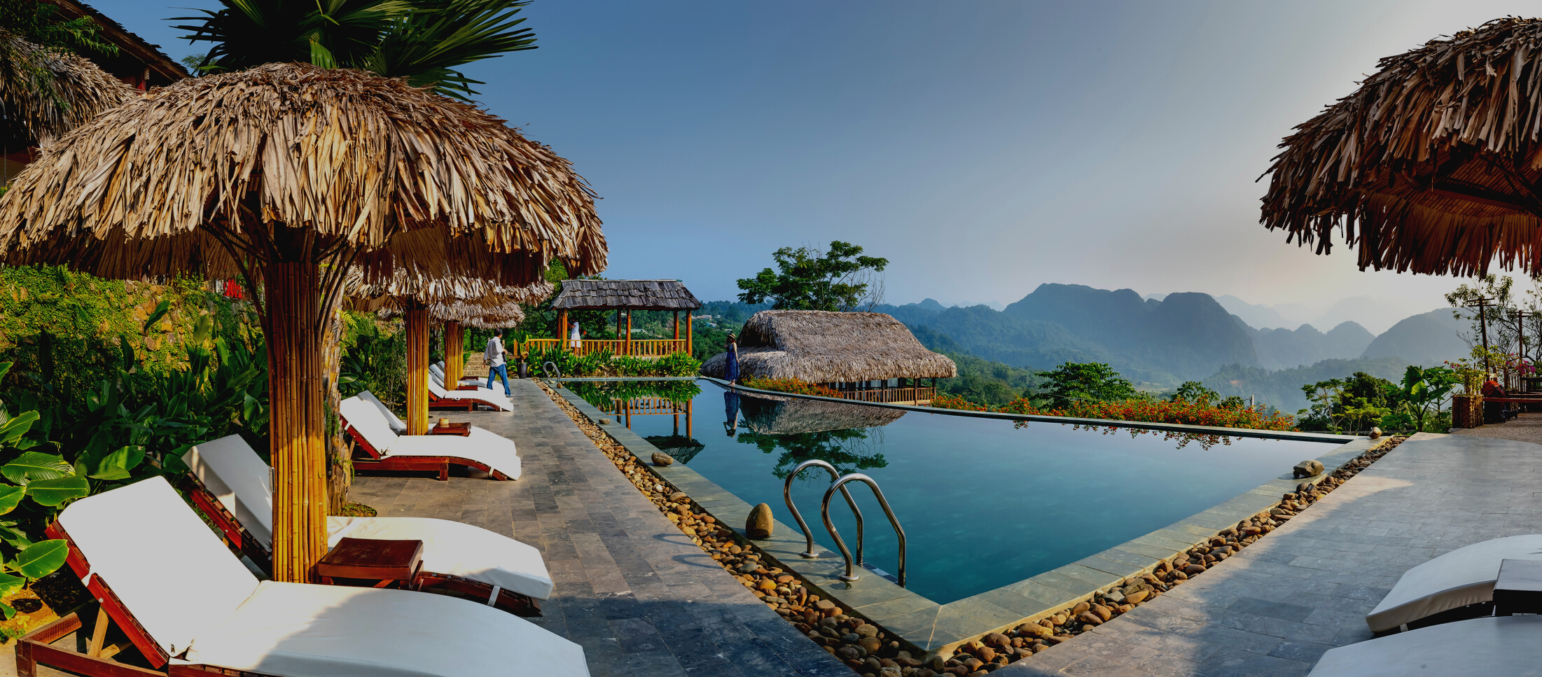 Exotic hotel with swimming pool in tropics